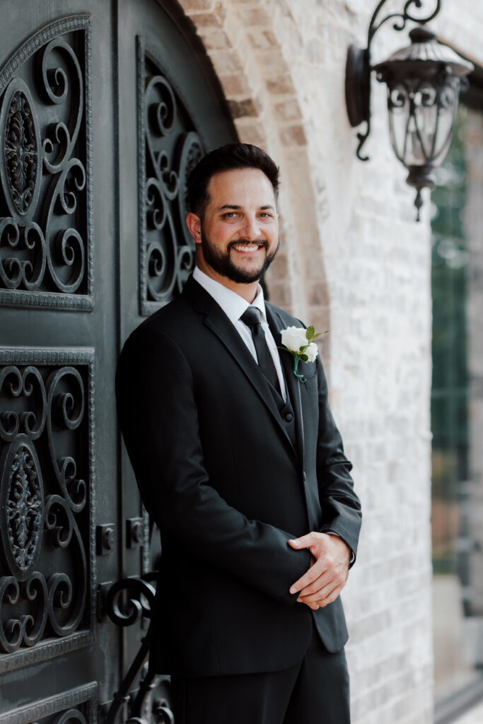 Fort Worth wedding venue groom in cocktail attire