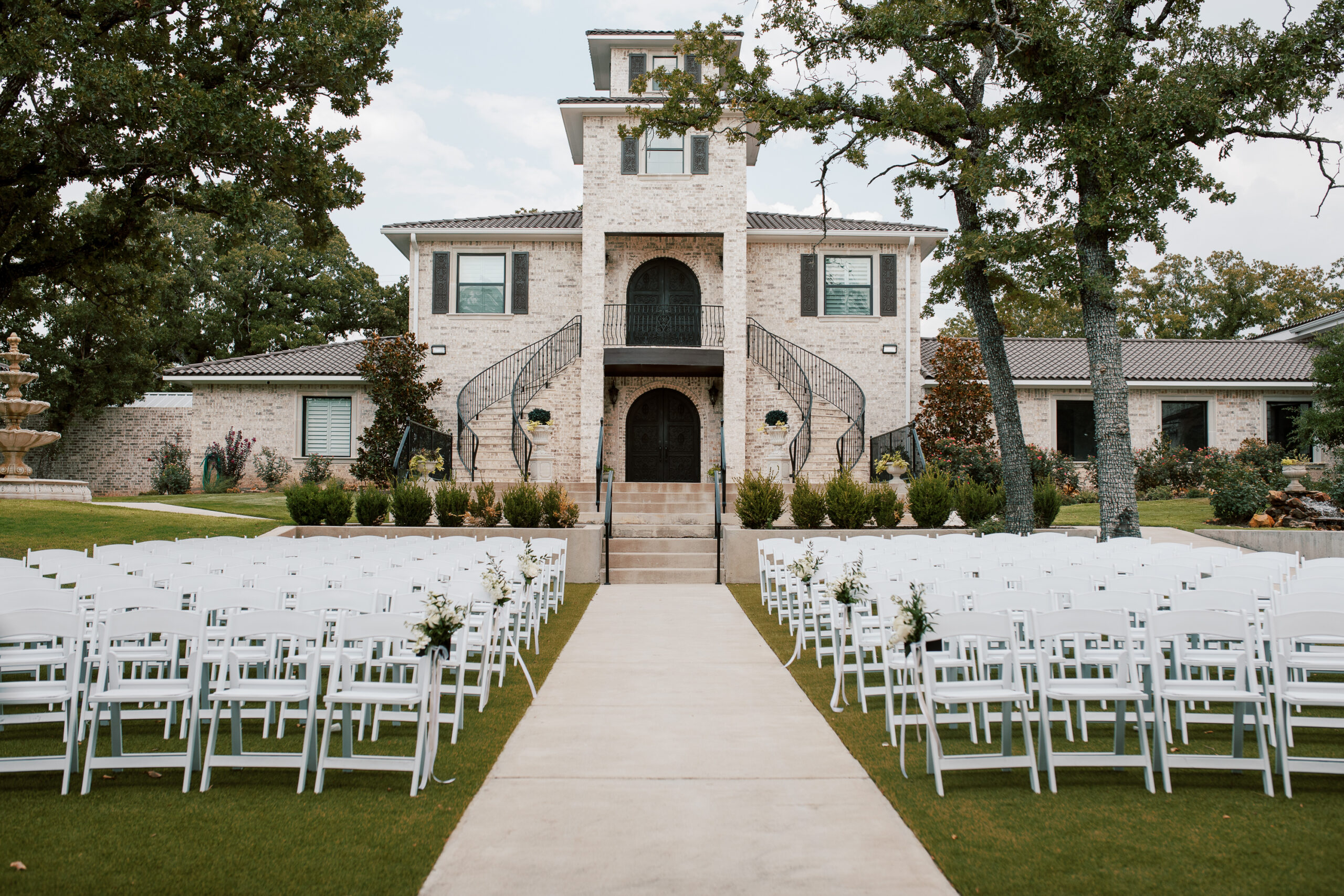 Fort Worth Texas wedding venue outdoor ceremony with luxury landscaping, designer decor, ceremony chairs and design features