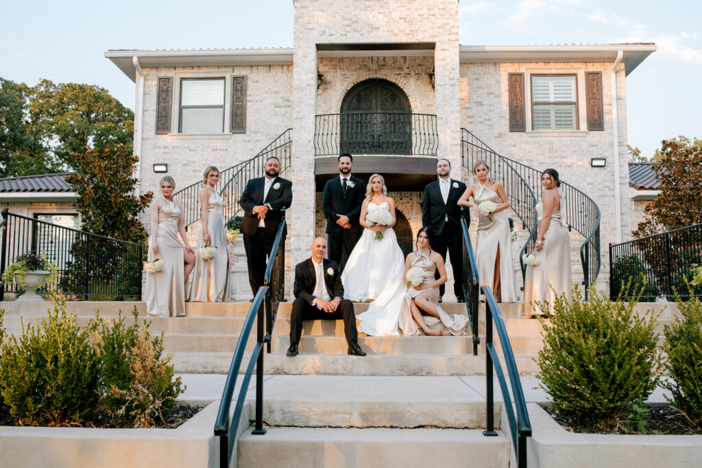 Fort Worth wedding venue reception with luxury tables, upgraded chairs, elegant chandeliers, lighting and decor