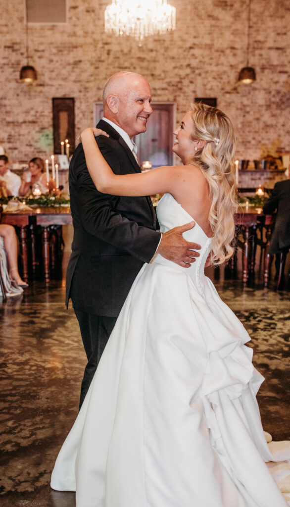 Fort Worth Wedding venue luxury bride and groom dancing at their European villa style wedding reception