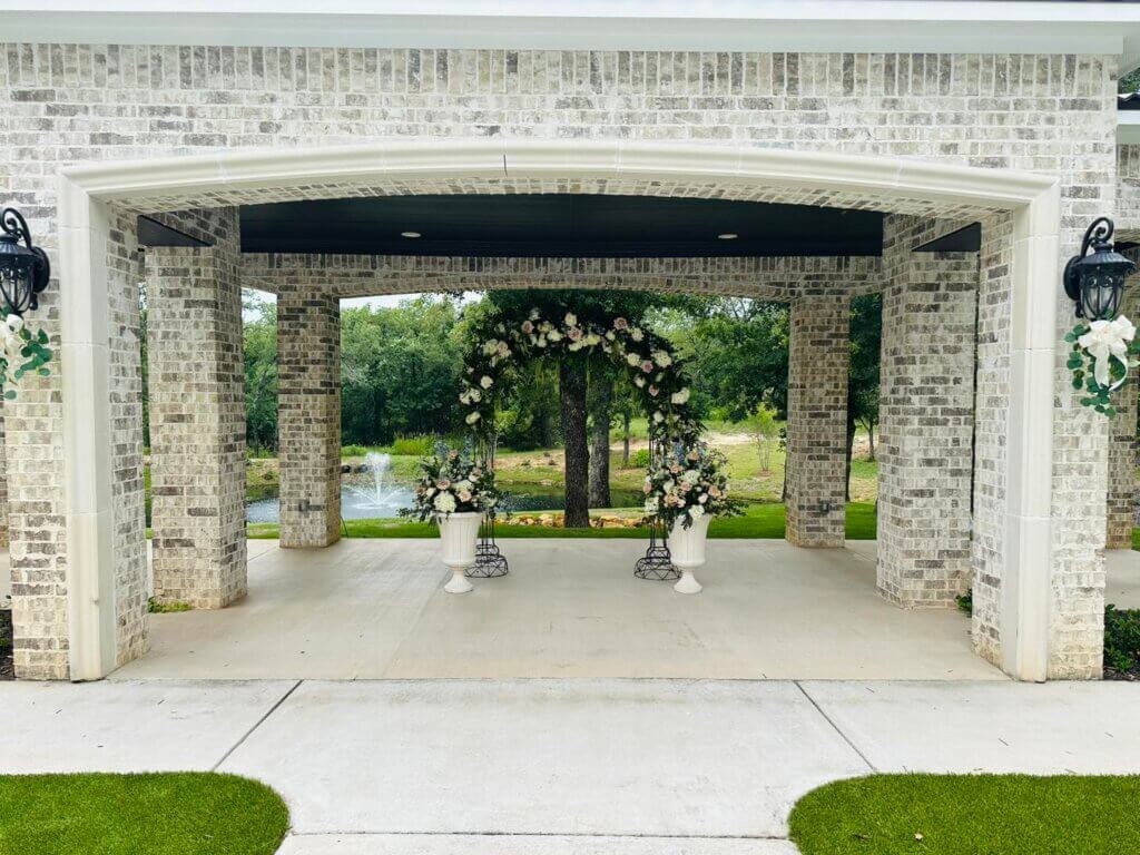Outdoor wedding ceremony with luxury flowers and secret garden