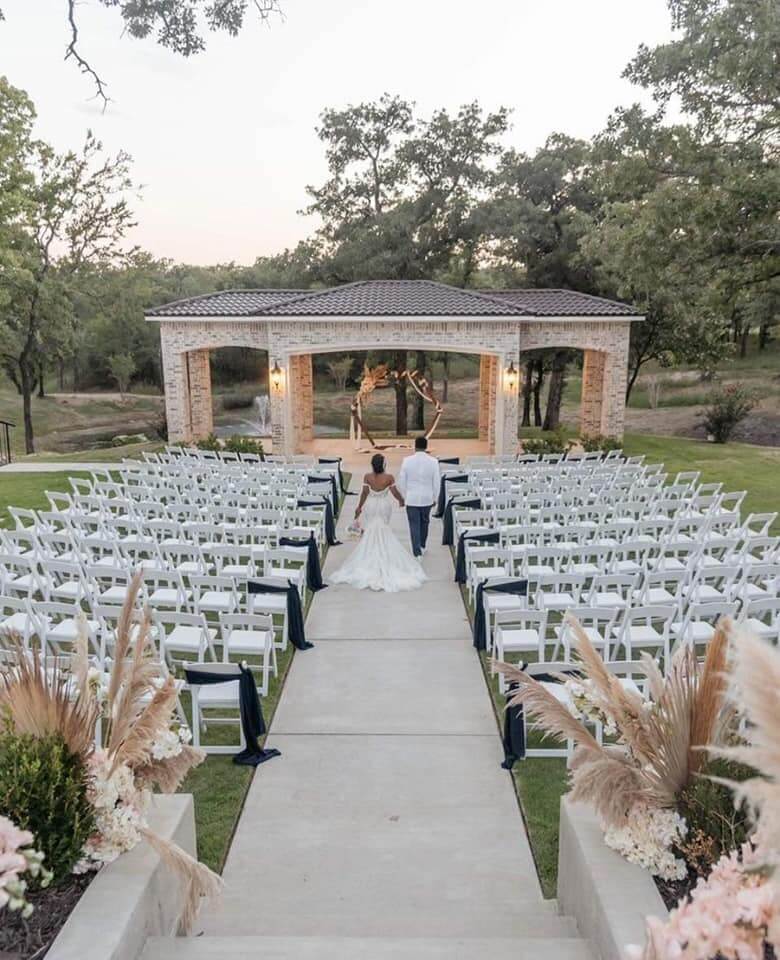 Luxury outdoor wedding setting at La Bella Luna with romantic pathways.