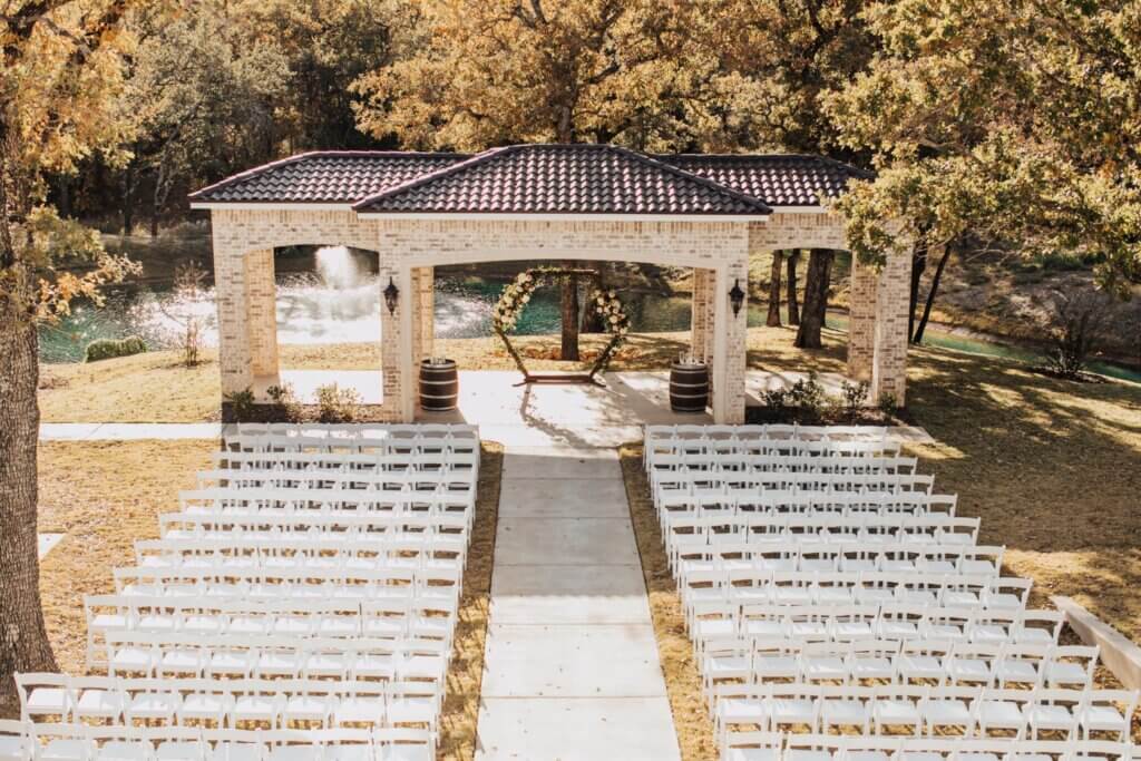 Beautiful outdoor wedding ceremony at our elegant, European inspired wedding venue near Fort Worth